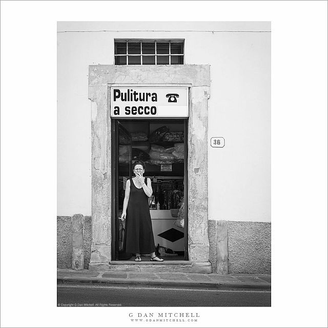 Woman in Dry Cleaner Doorway