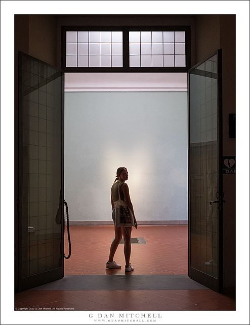 Woman in Museum Doorway