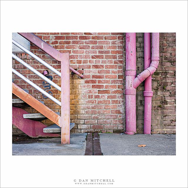 Brick Wall, Pipes, and Stairway