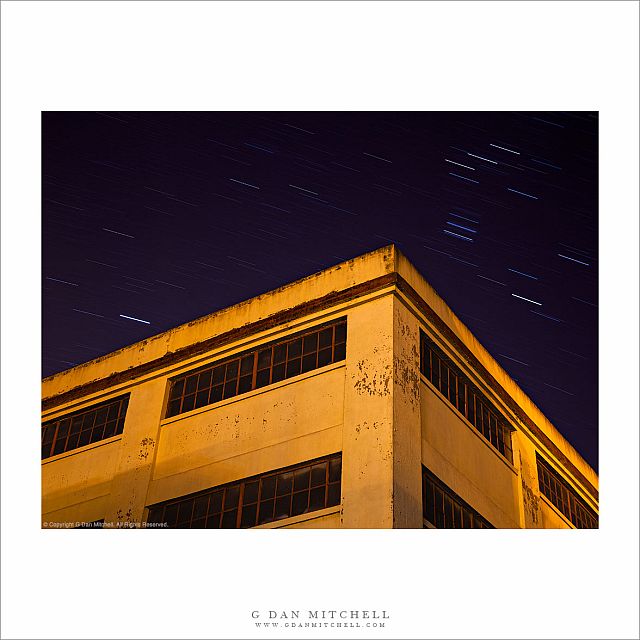 Yellow Building With Dark Windows, Star Trails