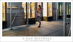 Woman Walking Past Scaffolding