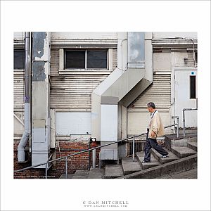 Man Descending Sidewalk Steps